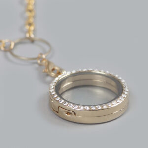 glazen medaillon rond goud steentjes