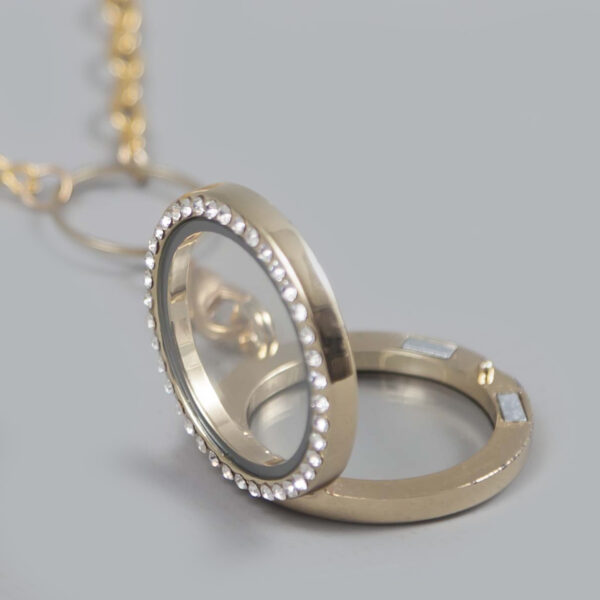 glazen medaillon rond goud steentjes